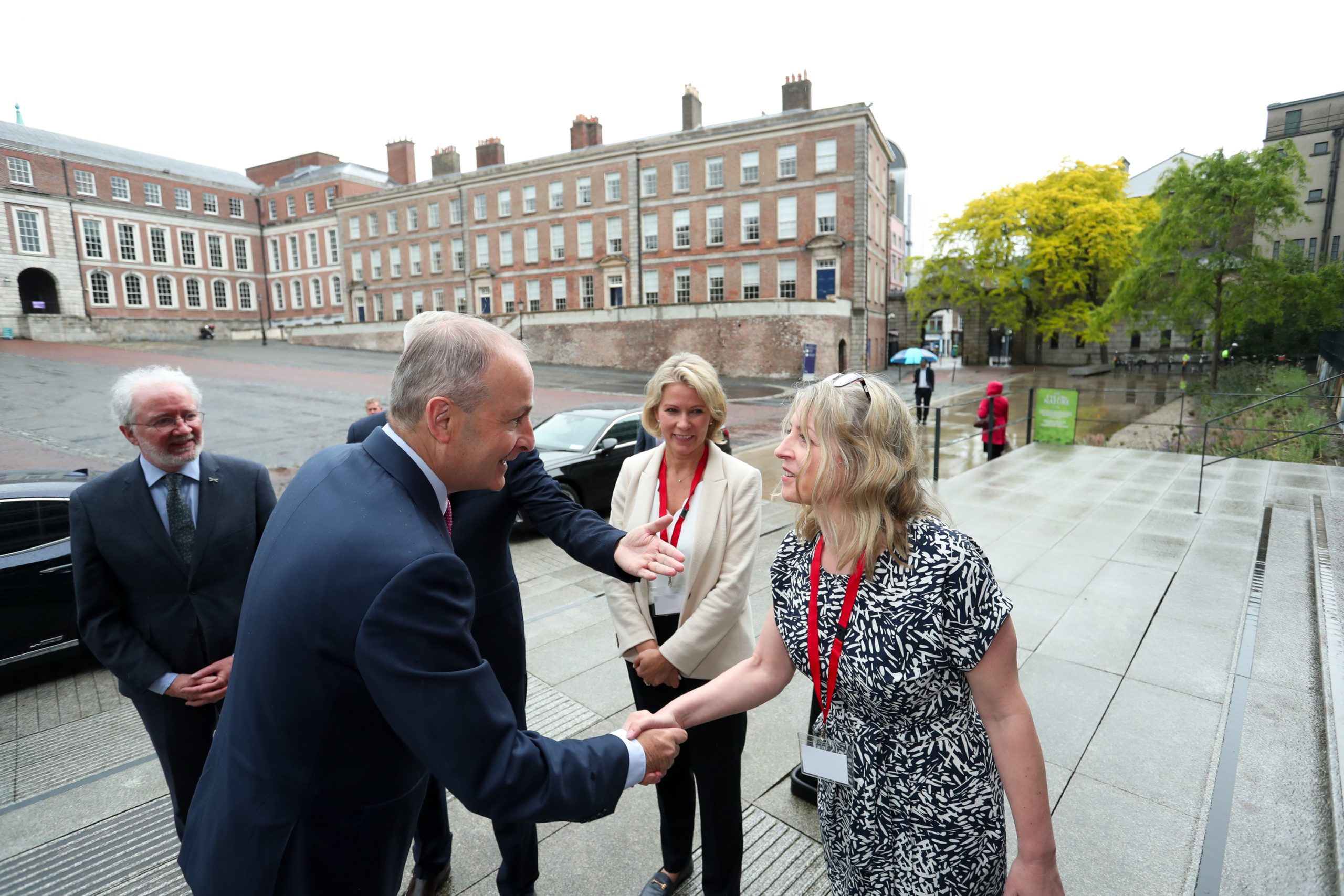 Taoiseach Micheal Martin is welcomed by the staff.
