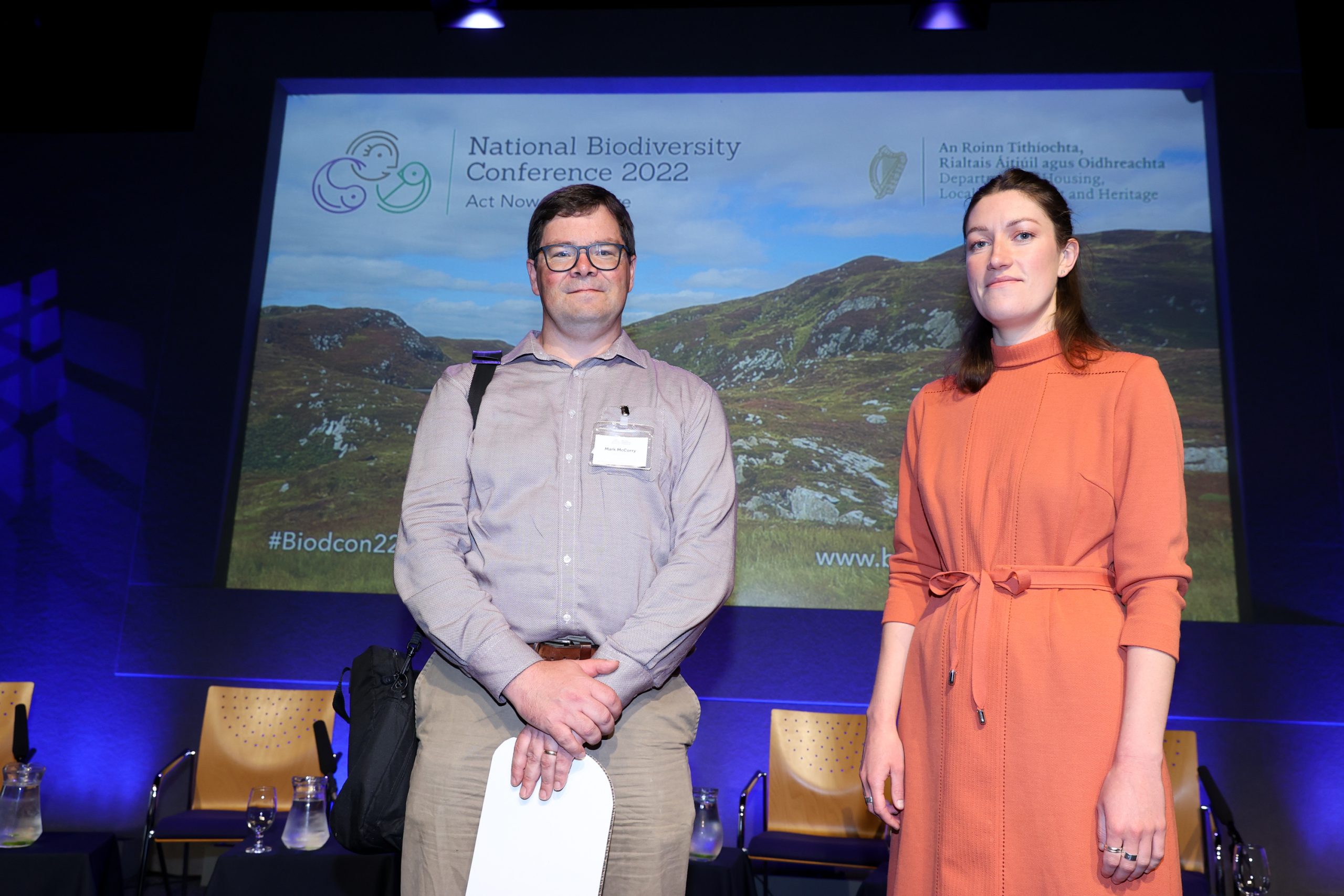 Ecologist Mark McCorry and a woman posing at a conference.